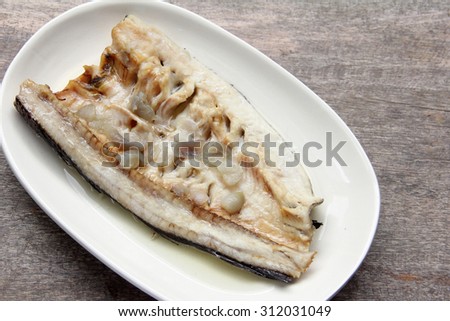 Thai food, white steam river fish on white dish plate