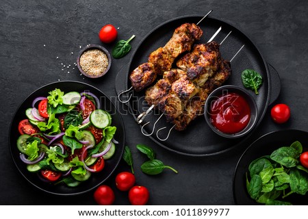 Similar – Image, Stock Photo Food background with tasty chicken drumstick casserole, ingredients for healthy cooking and kitchen utensils. Top view. Frame