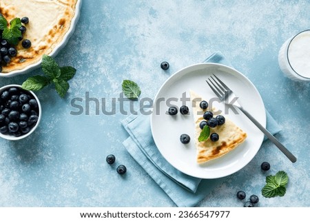 Similar – Foto Bild Käsekuchenscheibe auf blauem Teller. Ein Stück Käsekuchen