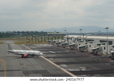 KUALA LUMPUR, MALAYSIA - DECEMBER 10, 2014 : Air Asia Airplanes embarking at KLIA2 airport. AirAsia QZ8501 from Indonesia to Singapore reported lost contact with air traffic control, 28 December 2014.
