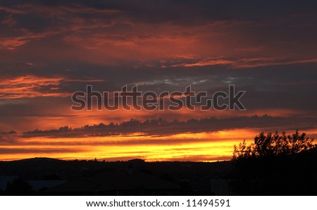 Beautiful landscape at sunset with blue, pink, yellow and orange color clouds