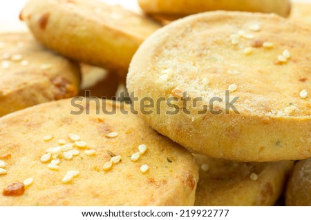 Cheese biscuits, mini pizza with sesame seeds