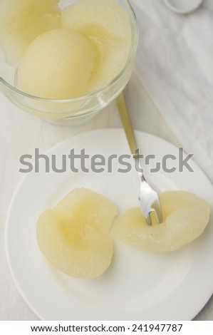 Canned pear dessert on a white plate