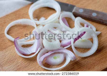Chopped red and white onion on a cutting board