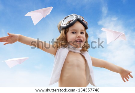 A child plays an airplane pilot