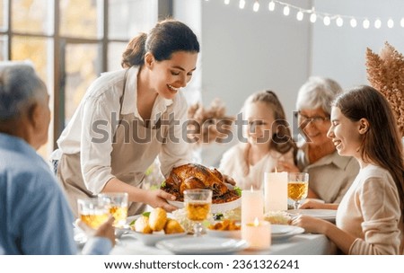 Thanksgiving Day, Autumn feast. Happy family sitting at the table and celebrating holiday. Grandparents, mother and children. Traditional dinner. Foto stock © 