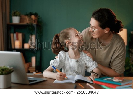 Similar – Image, Stock Photo Young woman doing homework on sofa