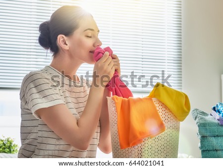 Similar – Image, Stock Photo Mother doing the laundry together with her young child
