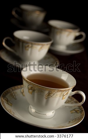 four china cups with drink