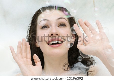 girl in the bathroom with soap bubbles
