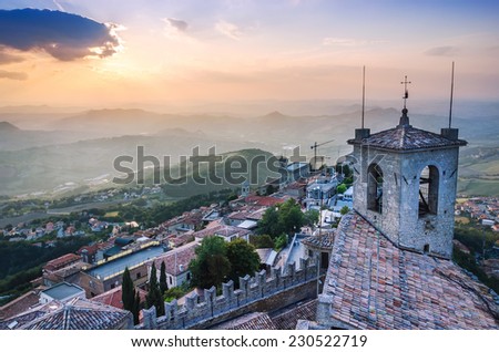 Top view of city filled with sunset light, San Marino.