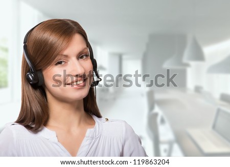 Portrait of a friendly call center operator, office background