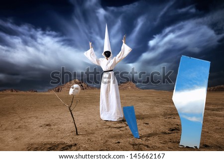 Strange figure in white cloak with the mirrors in desert. Artwork