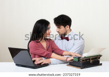 Blogger evolution concept. Woman and retro style man typing crossing their hands