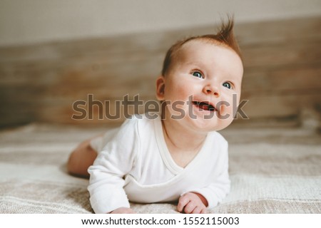 Similar – Image, Stock Photo 3 month old baby doing tummy time; bohemian interior room with houseplants