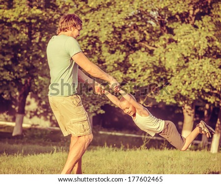 Family Father Man and Son Boy playing Outdoor Happiness emotions Lifestyle with summer nature on background