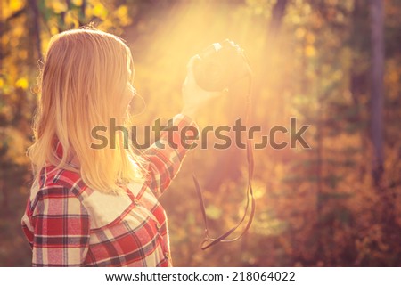 Young Woman with retro photo camera taking selfie shot outdoor hipster Lifestyle forest nature on background