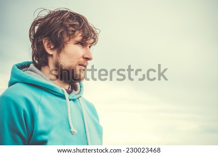 Young Man Face Portrait Beard and curly hair Outdoor Lifestyle Urban Fashion Travel concept