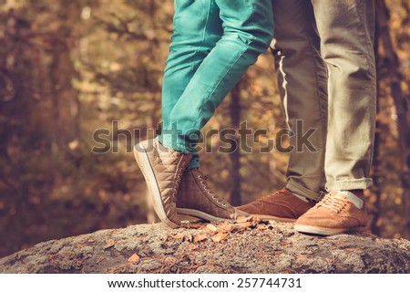 Couple Man and Woman Feet in Love Romantic  Outdoor Lifestyle with nature on background Fashion trendy style