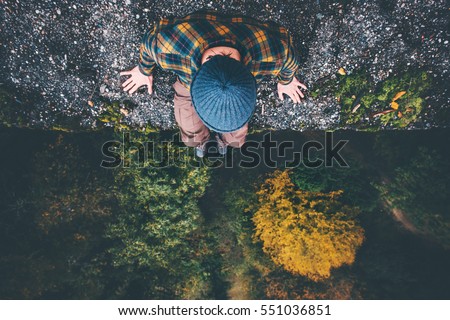 Similar – Image, Stock Photo Aerial view of man standing on the cliff edge enjoying Iceland highland valley and Haifoss waterfall