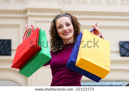 Young woman with color bags