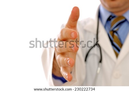 Doctor going to shake your hand. Shallow depth of field, focus on finger-tips.