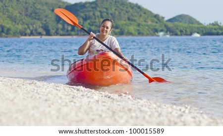 Asian women on a sea kayak