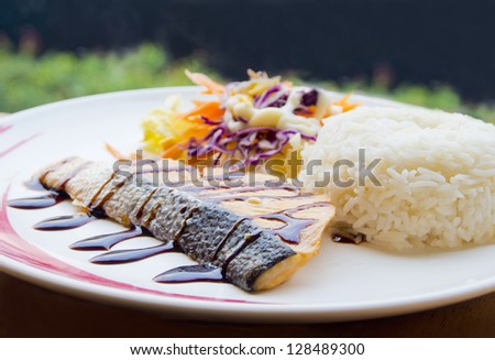 salmon steak sauce teriyaki with rice and vegetables