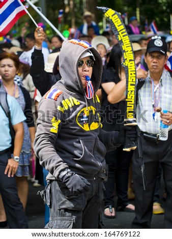 BANGKOK, THAILAND - NOVEMBER 27: Protesters hold an anti-government rally on November 27, 2013 in Ministry of industry\'s office. They blow whistles to make symbolic protest against the amnesty bill.