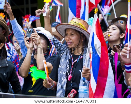 BANGKOK, THAILAND - NOVEMBER 27: Protesters hold an anti-government rally on November 27, 2013 in Ministry of industry\'s office. They blow whistles to make symbolic protest against the amnesty bill.