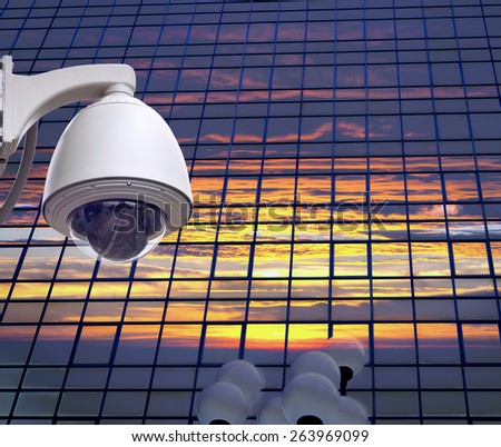 cctv installed on the wall on window glass of building , outdoor security