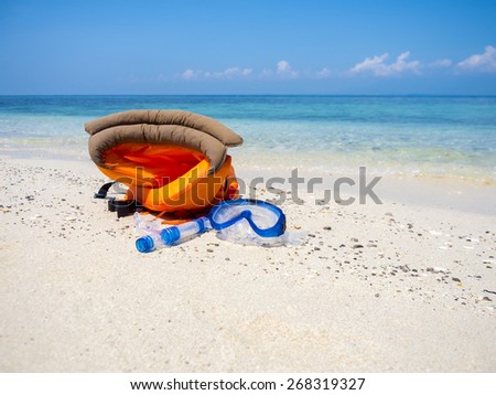 dive equipment on white sand beach in the sea shore