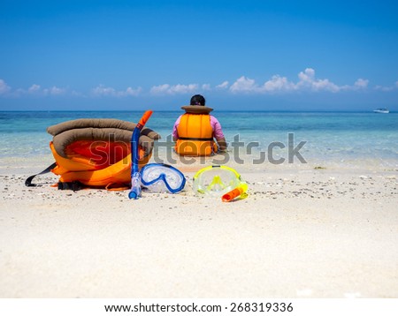 dive equipment on sea shore in vacation trip, tropical summer ocean