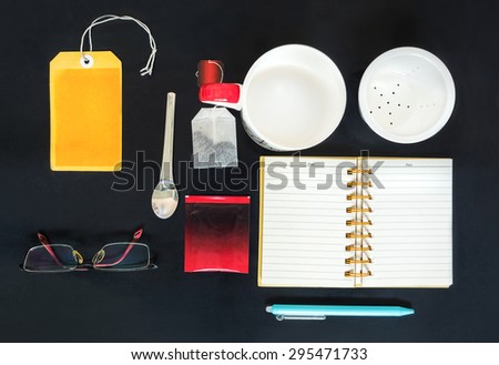 tea set with notebook , pen and glasses mockup on black background