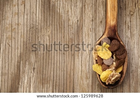 Chocolate muesli in wooden spoon