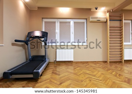 exercise room interior-gym with running treadmill