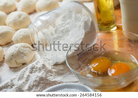 Small balls of dough with flour for pizza or cakes and scones