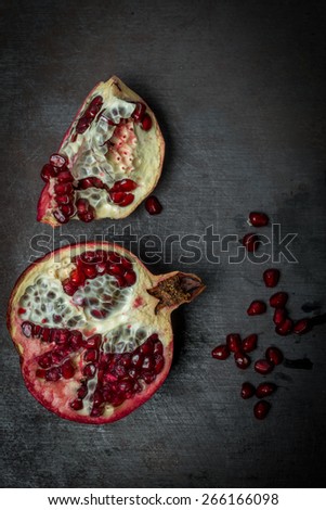 Luxurious pomegranate background. Pomegranate core on black background