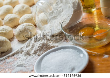 Small balls and ingredients of fresh homemade pizza dough