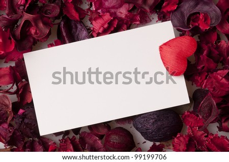 white label on rose petals and heart