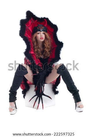 Beautiful brown-eyed girl posing dressed as devil