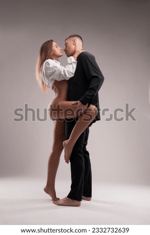 Similar – Image, Stock Photo Delicate multiethnic couple hugging under natural arch of flowers