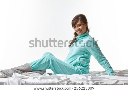 Cute pregnant woman posing in comfortable clothes