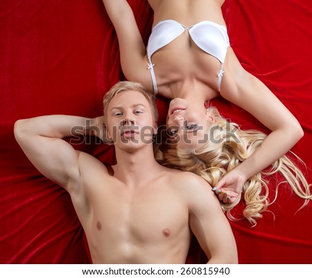 Top view of beautiful heterosexual couple in bed