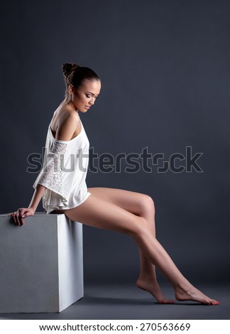 Model posing in sexy blouse with bared shoulder