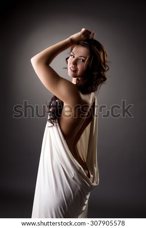 Lovely model posing in loose-fitting dress