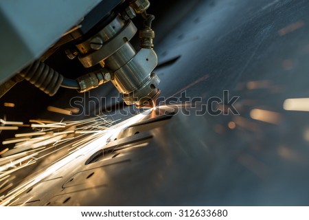 Laser cutting of metal sheet, close-up