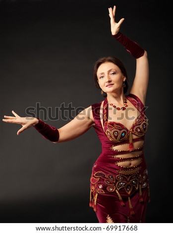 Beauty mature woman dance in arabic costume