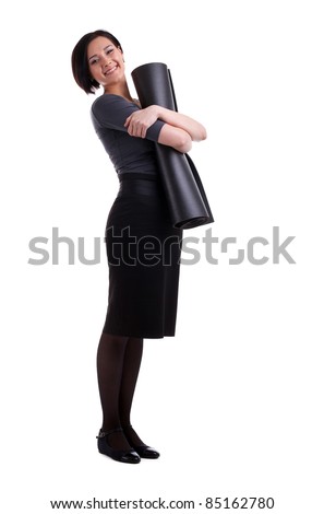 Happy business woman with yoga rubber mat