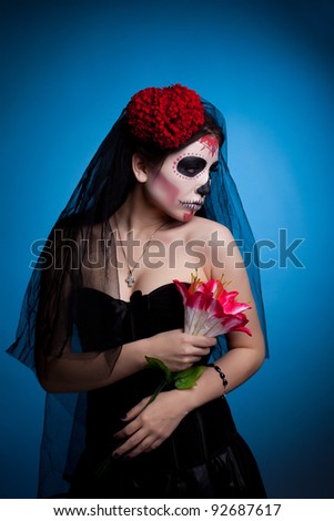 woman in skull face art mask  All Souls Day